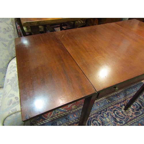 4199 - A Georgian mahogany lamp table with drop-flaps, single drawer, chamfered legs to castors, 73cm x 61c... 