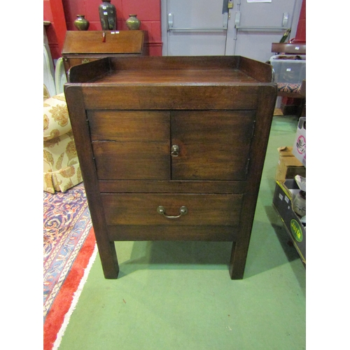 4200 - A George III mahogany nightstand the gallery top over a two door cupboard and single drawer on squar... 