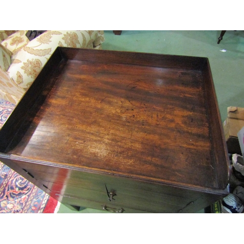 4200 - A George III mahogany nightstand the gallery top over a two door cupboard and single drawer on squar... 