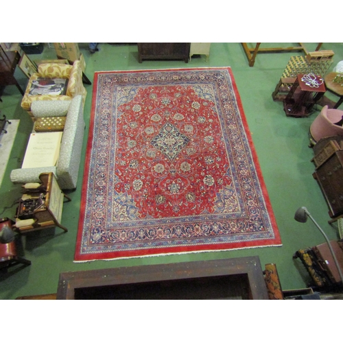 4504 - An Eastern wool rug, red ground central single medallion flanked by blue multiple borders, 400cm x 3... 