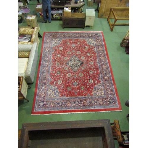 4504 - An Eastern wool rug, red ground central single medallion flanked by blue multiple borders, 400cm x 3... 