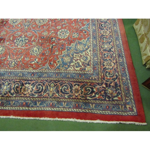 4504 - An Eastern wool rug, red ground central single medallion flanked by blue multiple borders, 400cm x 3... 