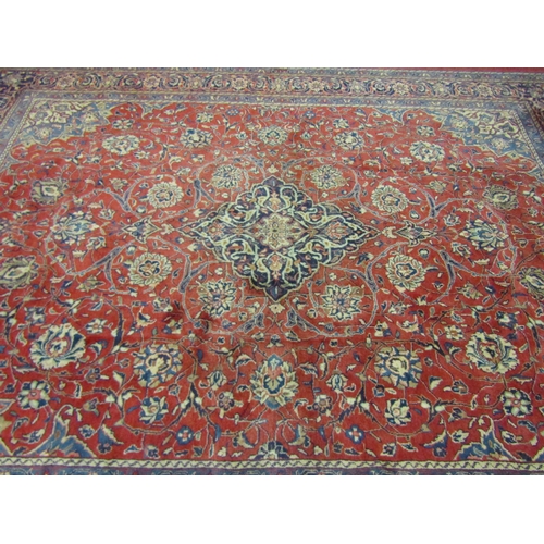 4504 - An Eastern wool rug, red ground central single medallion flanked by blue multiple borders, 400cm x 3... 