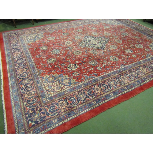 4504 - An Eastern wool rug, red ground central single medallion flanked by blue multiple borders, 400cm x 3... 