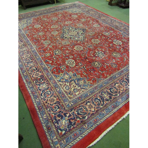 4504 - An Eastern wool rug, red ground central single medallion flanked by blue multiple borders, 400cm x 3... 