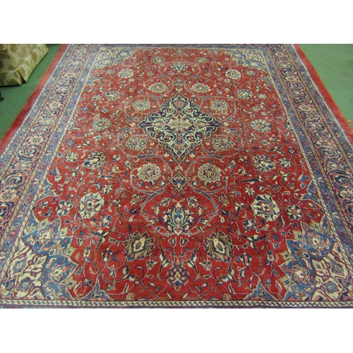 4504 - An Eastern wool rug, red ground central single medallion flanked by blue multiple borders, 400cm x 3... 