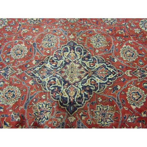 4504 - An Eastern wool rug, red ground central single medallion flanked by blue multiple borders, 400cm x 3... 