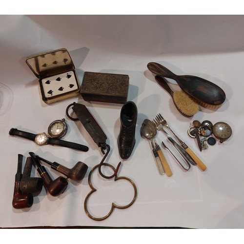 4356 - A box containing small miscellaneous items to include cast metal shoes, various smoking pipes, a gen... 