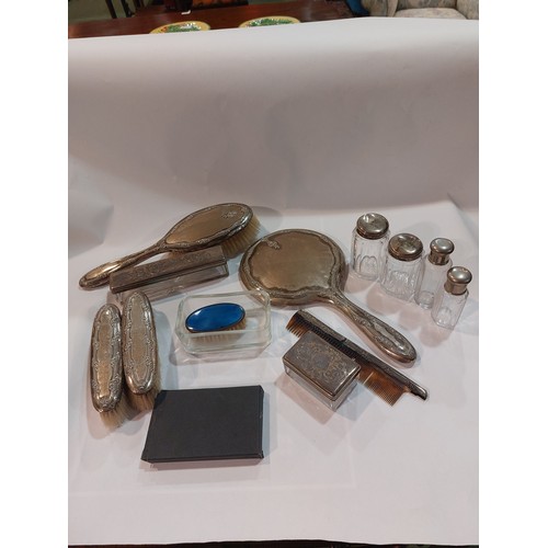 4378 - A silver backed dressing table set together with various plated dressing table pots, etc.