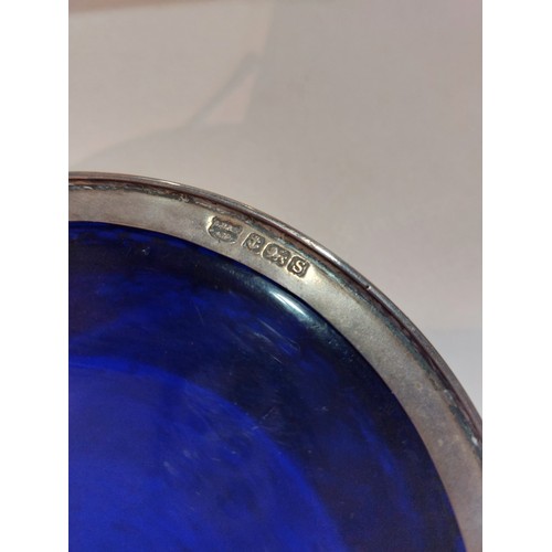 4384 - A silver coaster with blue glass liner, Birmingham, circa 1917