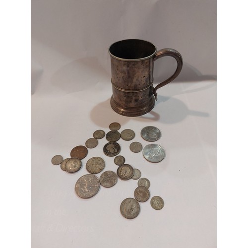 4385 - A Sheffield plate tankard with a selection of coinage including florins