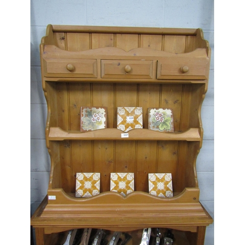 2227 - A pine wall rack with three drawers