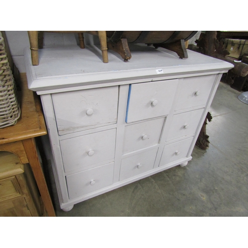 2239 - A painted pine chest of nine drawers