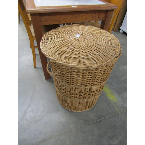 2255 - A good size wicker lidded laundry basket