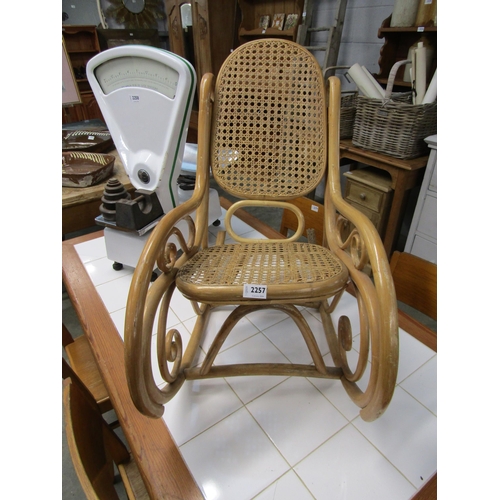 2257 - A Thonet bentwood child's cane seated rocking chair