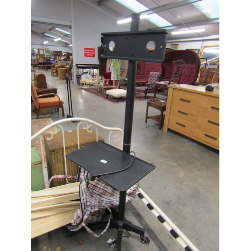 2287 - A metal full height T.V. stand on castors