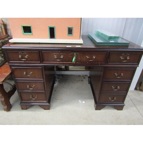 2315 - A reproduction mahogany twin pedestal desk with tooled green leather top