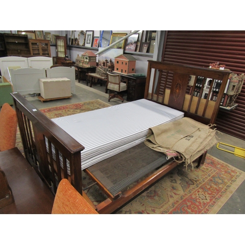 2325 - An Edwardian mahogany double bed frame with marquetry inlay and sprung base