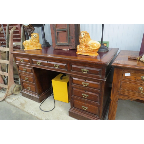 2060 - An Edwardian mahogany twin pedestal nine drawer desk with red leather inset top by Edwards & Roberts... 