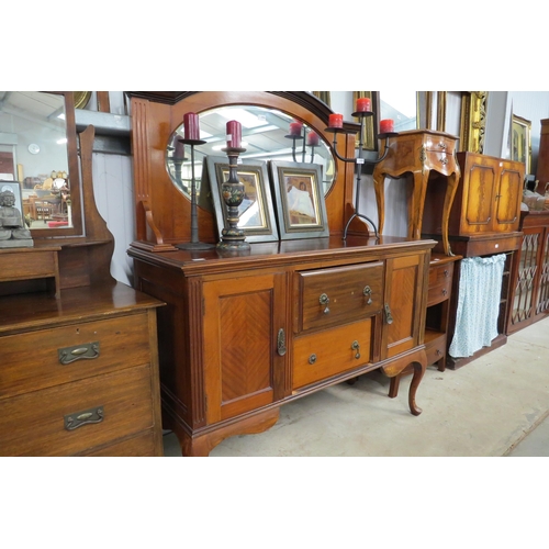 2084 - A 1930's walnut sideboard, oval mirror gallery back over two drawer and two cupboard base, cabriole ... 