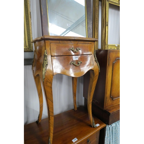 2090 - A reproduction French Kingwood and marquetry bedside table with serpentine form with two drawers