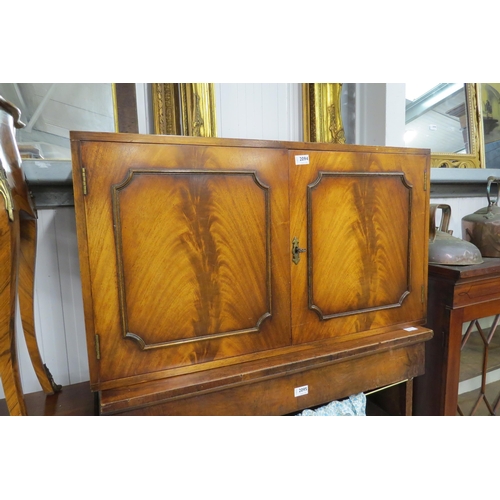 2094 - A flamed mahogany two door drinks cabinet with glass sheleved interior 95w x 53t x 32cm deep