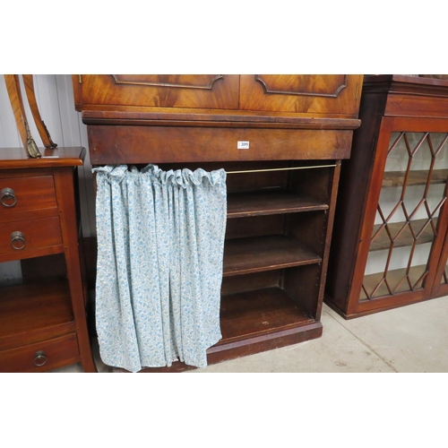 2095 - A 19th Century bookcase with cushion drawer, plinth base