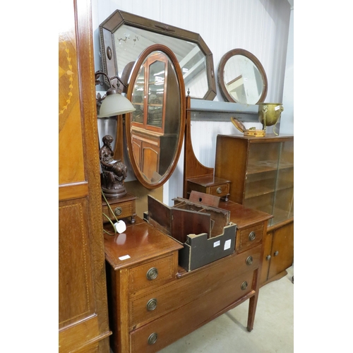 2101 - An Edwardian mahogany dressing chest, oval mirror back, four drawer base