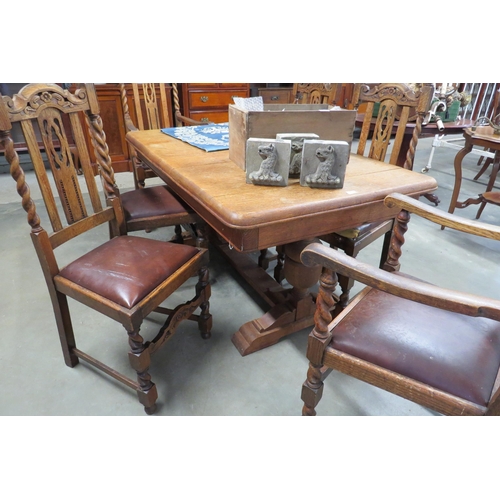 2153 - A 1930's oak drawleaf dining table and six (4+2) chairs, one seat pad split    (R) £100