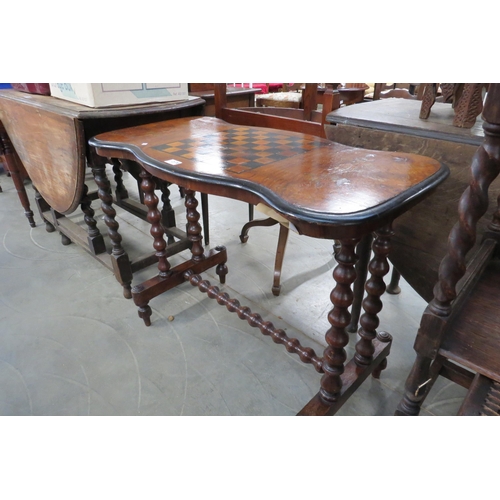 2170 - A Victorian walnut and marquetry stretcher table with checkboard inlay