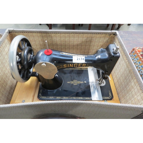 2174 - A cased hand driven sewing machine