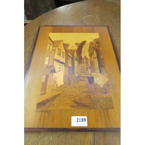 2189 - A marquetry inlaid wall panel of multipul woods         (E) £20-30