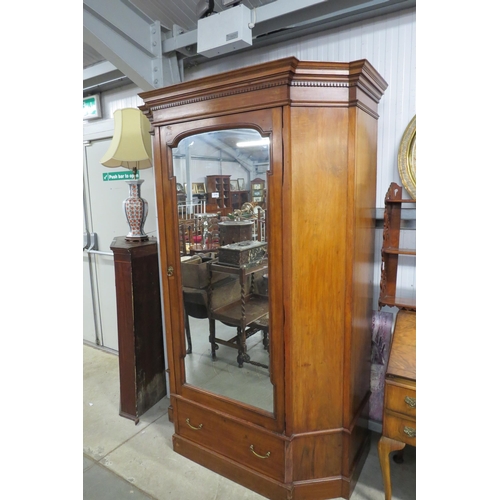 2191 - A Edwardian walnut Armoire wardrobe with central dress mirror door in three sections