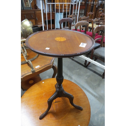 2145 - A small inlaid mahogany tripod wine table     (E) £10-20 (Group with lot 2146)