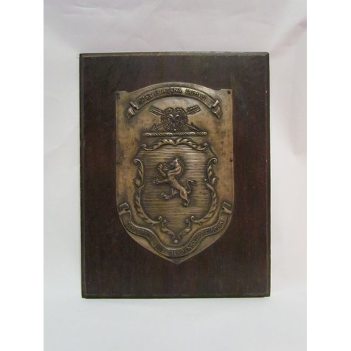 4290 - A metal crest plaque mounted onto board, 