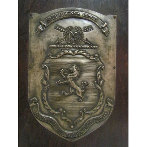 4290 - A metal crest plaque mounted onto board, 