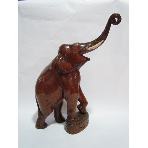 4315 - A carved figure of a rearing elephant , 44cm tallest point