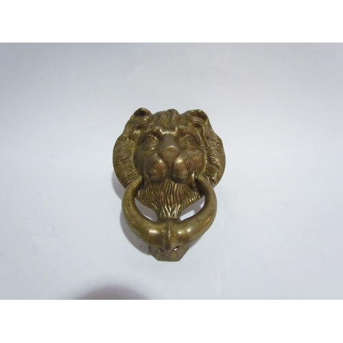 4325 - A brass lions head door knocker