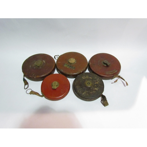 4328 - Five bygone leather cased tape measures        (E) £15-20