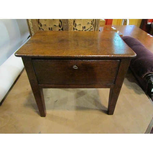 4010 - A George III oak stool with round cornered top over a frieze drawer with working key on square taper... 