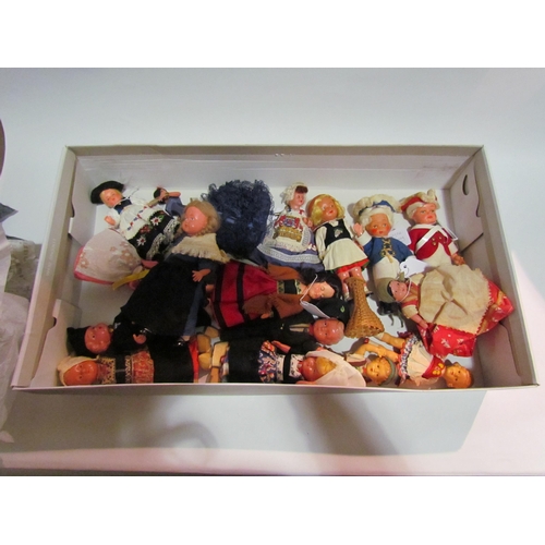 4206 - A collection of toys and dolls to include dolls house furniture in original boxes, clockwork Japanes... 