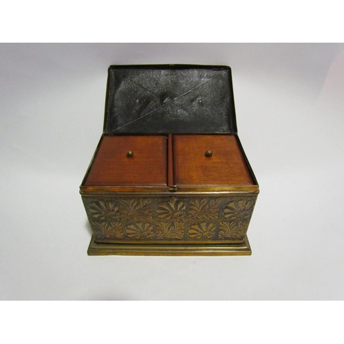 4209 - A brass tea caddy with foliate design in relief