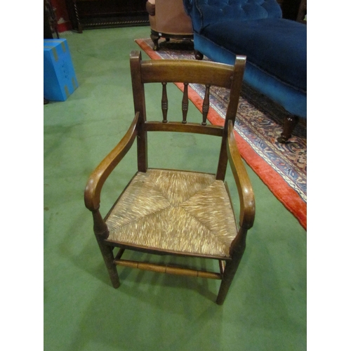 4230 - A 19th Century spindle back chair with rush seat, 66cm x 36.5cm x 33cm      (R) £20