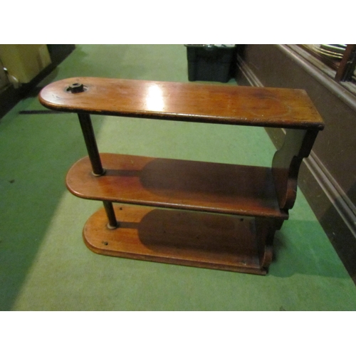 4236 - A three tier hardwood and brass shelf, 46cm tall x 54cm long