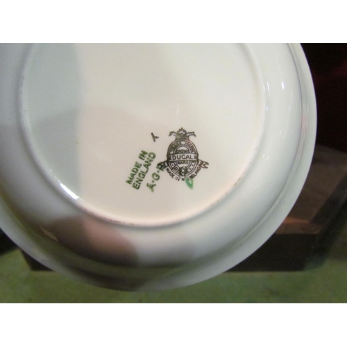 4344 - A Ducal ware white and green ground part dinner service with gilt embellishment, six place setting i... 