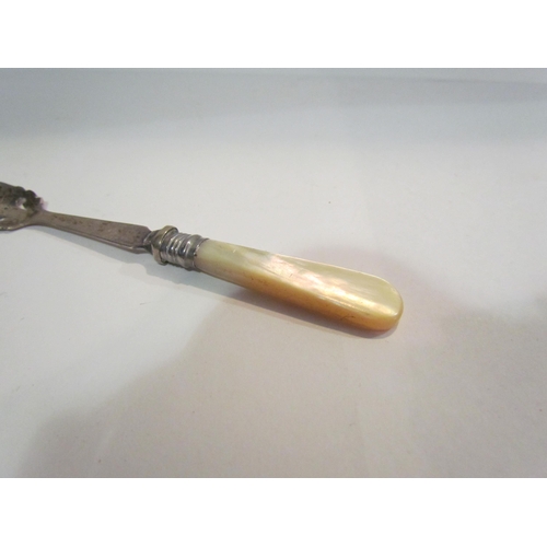 4399 - An unusual silver plated, mother-of-pearl handled orange peeler, registered design number 389455   (... 