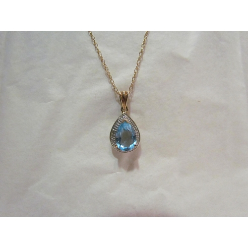 4401 - A 9ct topaz and diamond set pendant on 9ct chain approx 2.5g