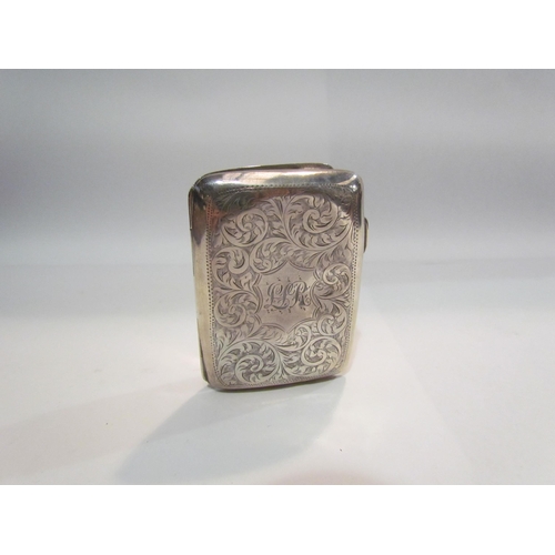 4402 - A silver cigarette case, scrolled foliate engraved, dented