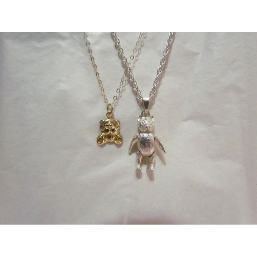 4418A - An articulated bear pendant hung on chain and a 9ct gold necklace with bear pendant