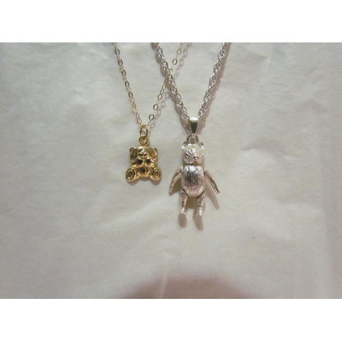 4418A - An articulated bear pendant hung on chain and a 9ct gold necklace with bear pendant